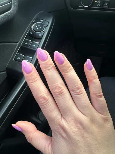 Pink and lavender almond nails with a flowing accent design