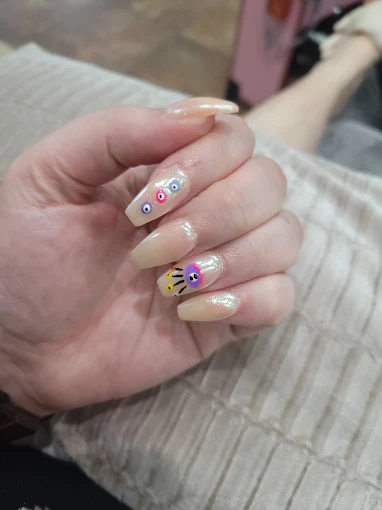 Pastel manicure with tiny flowers, dots, and delicate art